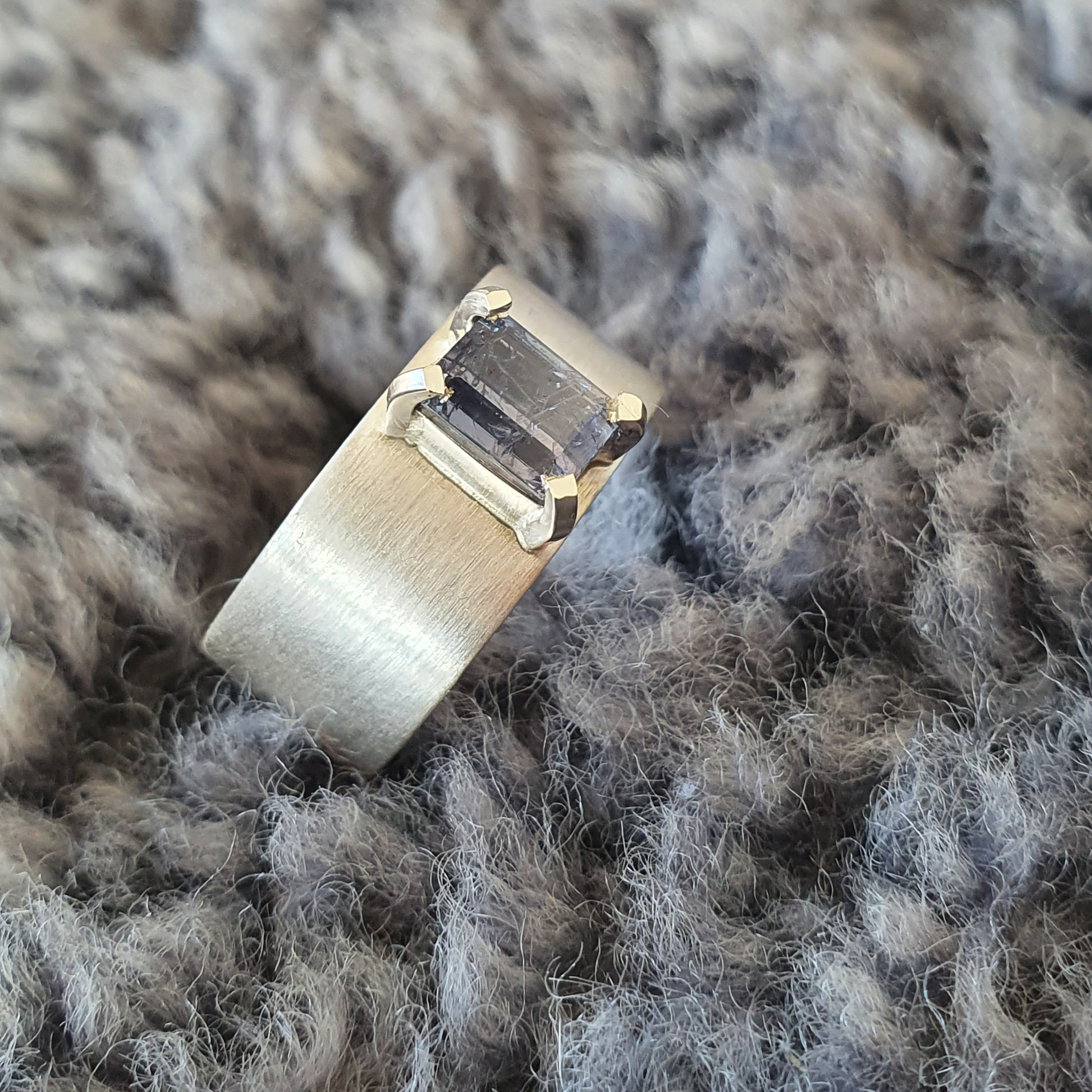 Brushed silver ring with sapphire